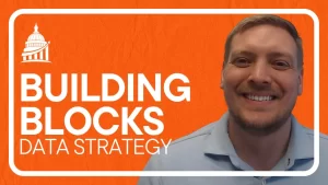Video thumbnail showing the six building blocks of data strategy with smiling presenter on orange background.